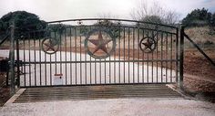 an iron gate with two stars on it