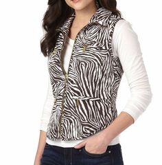 Details & Care This puffer vest with zebra print from Michael Kors will help keep you warm and fashionable this winter. Bold patterning and gleaming zips add polish to a sporty diamond-quilted vest styled for a fitted silhouette with a curved, shirttail hem. 22 1/2" regular length (approx) Front zip closure. Four zip-welt pockets. Fully lined, with 100% polyester fill. 100% polyester. Dry clean or machine wash warm, tumble dry low. By MICHAEL Michael Kors; imported. IMPORTANT INFORMATION · Blouse Tops Designs, Turtleneck Sleeveless, Vest Fashion, Mock Turtleneck, Basic Tops, Puffer Vest, Zebra Print, Stripe Print, Chocolate Brown