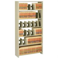 a metal book shelf with many books on the top and bottom shelves in different colors