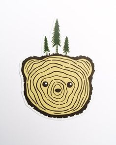 a sticker depicting a bear's head with trees on it