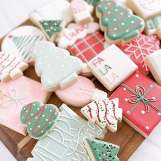 decorated christmas cookies on a cutting board