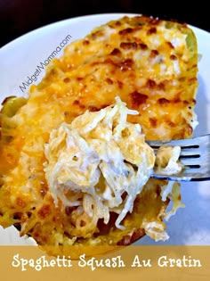 a white plate topped with a slice of spaghetti casserole next to a fork