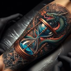 a tattoo with an hourglass and a snake on the arm that is in front of it