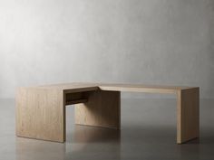 a wooden desk sitting on top of a gray floor