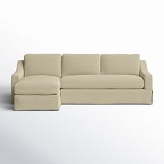 a white couch sitting on top of a white floor