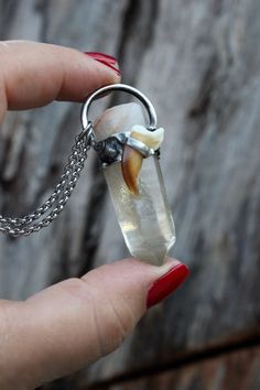 This highly powerful stone that vibrates with ethereal energy is known as Lemurian citrine quartz crystal and is called by some "the keeper of wisdom." Mined in Brazil in its raw and natural formation, with some degree of imperfection and with slightly chipped causes either by natural or mining processes. The quartz is adorned with a coyote claw. The pendant was crafted using lead-free solder over copper and finish it with dark oxidizing patina to create a rustic antique look. ︎>> NOTE: "One of a Kind" You'll receive this exactly piece Created with: *raw Lemurian citrine quartz crystal *coyote claw *lead free solder *stainless steel chain *lobster clasp *pendant approx. 2" inches *pendant is hanging from 18" chain (photo) *please chose your desire length from 16-28 ︎>> ⫸ ❂▲Coyote It's a te Lemurian Crystal, Les Chakras, Boho Stil, Crystal Quartz, Stainless Steel Chain, Plexus Products, Nature Inspired, Boho Style, Crystal Necklace