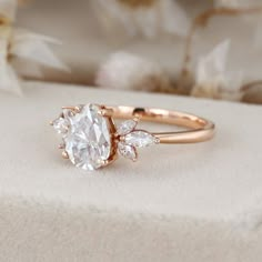 a rose gold ring with an oval cut diamond