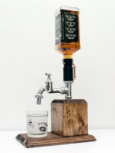 an old fashioned dispenser is being used as a coffee grinder for drinks