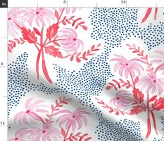 a pink and blue floral print on white fabric with dots in the background, as well as a ruler