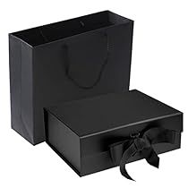 an open black gift bag with a bow on the front and side, sitting next to it