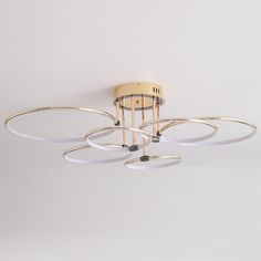 a modern ceiling light with four circular lights