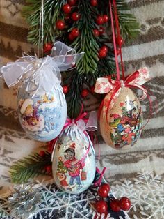 three ornaments hanging from a christmas tree