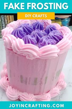 a pink and purple cake sitting on top of a white marble table with text overlay saying, fake frosting diy crafts