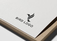 the bird logo is displayed on a white paper