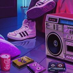 a person's feet are shown next to a boombox and soda cans