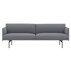 a gray couch sitting on top of a white floor next to a black metal frame