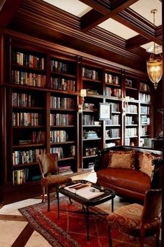 a living room filled with lots of furniture and bookshelves covered in bookcases