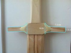 a wooden cross is shown with measurements for the top and bottom pieces, along with an arrow