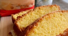 three slices of pound cake sitting on top of a cutting board next to a bag of semollina