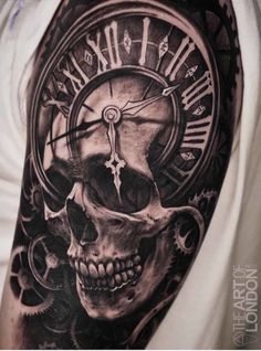 a man with a clock and skull tattoo on his arm