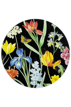 a black plate with colorful flowers and butterflies on it