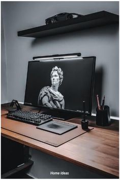 a desktop computer sitting on top of a wooden desk