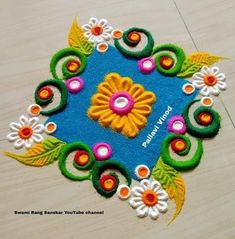 this is an image of a colorful flower design on the floor with text overlay