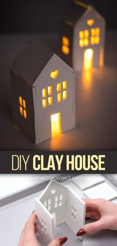 two paper houses that are sitting on top of a table with the words diy clay house