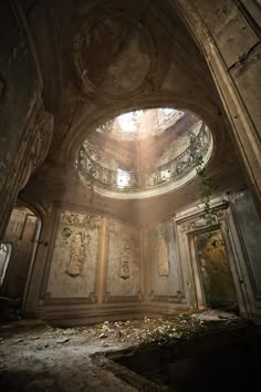 the interior of an abandoned building with sunlight streaming through