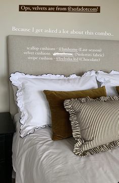 a bed with two pillows on it and a sign above the headboard that says, because i get used a lot about this combo