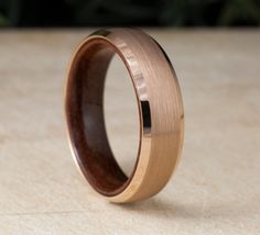 a wedding ring with a wooden inlay