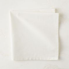 two white napkins sitting on top of each other