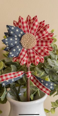 a red, white and blue flower in a vase