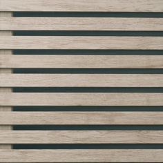 wooden slats are lined up against the wall