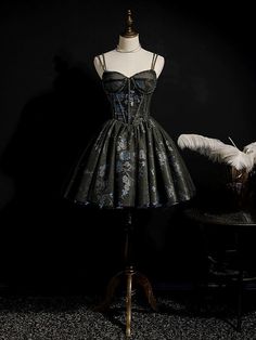 Make a striking entrance with this Gothic Black Short Wedding Party Dress. Perfect for those who love to blend elegance with a touch of gothic charm, this floral embroidered corset party dress is designed to turn heads at any special event. Exquisite Floral Embroidery: The bodice and skirt are beautifully adorned with intricate blue floral embroidery, creating a stunning contrast against the black fabric. This delicate detailing adds a romantic and sophisticated touch to the dress. Corset Bodice: The structured corset bodice, with its delicate straps, provides a flattering silhouette and excellent support. The corset is embellished with subtle beading, adding a hint of sparkle and luxury, ensuring you stand out. Flared Skirt: The full, flared skirt adds drama and elegance to the gown. Laye Black Wedding Dress Reception, Simple Gothic Wedding Dress, Black Elopement Dress Short, Black Wedding Reception Dress Short, Goth Cocktail Dress, Black Evening Dress For Costume Party Or Prom, Party Evening Dress With Corset Back, Black Evening Dress For Costume Parties And Prom, Black Evening Dress For Prom Season And Costume Party