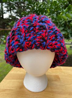 This exta thick, cozy crochet hat is a blend of red, deep blue and black acrylic yarn, hand crafted with love by Keeza. This hat is an adult size average to large.  All items are packed with care and shipped for free! Red Acrylic Beanie Cap, Red Crochet Beanie, One Size, Red Crochet Beanie, One Size Fits Most, Red Crochet Beanie One Size, Red Crochet Beanie One Size Fits Most, Red Yarn Crochet Beanie Hat, Red Crochet Yarn Beanie, Red Crochet Beanie From Yarn, Red Knitted Hat For Cold Weather