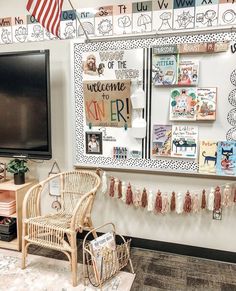 a room with a chair, television and bulletin board on the wall in front of it