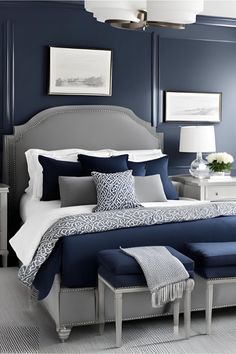 a bedroom with blue walls and white furniture