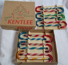 two boxes filled with colorful toothbrushes sitting on top of a white tablecloth