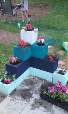 there are many flower boxes stacked on top of each other