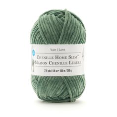 the yarn ball is green and has a white label on it that says, chemille home slim