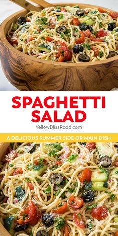 spaghetti salad with tomatoes, broccoli and olives in a wooden serving dish