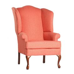 an upholstered wing chair with wooden legs and arm rests against a white background