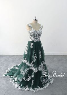 This is a customized product, please provide measurement and phone number when ordering. Thank you Lace Wedding Dress, A-line Dark green Tulle Lace Wedding Dress, Elegant Wedding Gown, Boho Wedding Gown with Corset Top 1.As always, Custom Made(your own size, your preferred color). 2.I carefully select high-quality beads, pearls, fabrics and threads to create every dress. 3.For this style, I need: 【Information required to place an order】 Color: 【Dark green tulle + ivory lace]】 Height: Bust: Waist Military Green Wedding Dress, White Dress With Green Accessories, White And Emerald Wedding Dress, Wedding Dress With Green Accent, Green A-line Wedding Dress, Green Ball Gown With Sweetheart Neckline For Prom, Green Gown With Fitted Bodice And Sweetheart Neckline, Green Ball Gown With Sweep Train And Sweetheart Neckline, Green Ball Gown With Sweetheart Neckline And Sweep Train