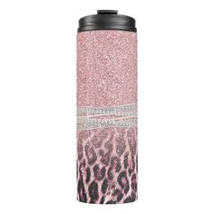 a pink and black leopard print tumbler with glitter on the side, in front of a white background