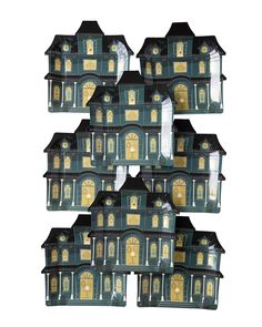 a set of six green and gold halloween houses with lights on the front, side, and top