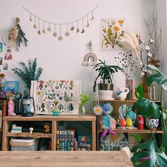 a room filled with lots of plants and decorations