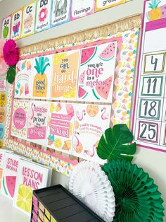 a bulletin board with lots of colorful papers on it and some paper flowers in front of it