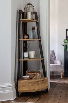 a tall wooden shelf sitting in the corner of a room