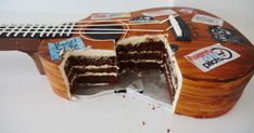 a cake that is sitting on top of a guitar